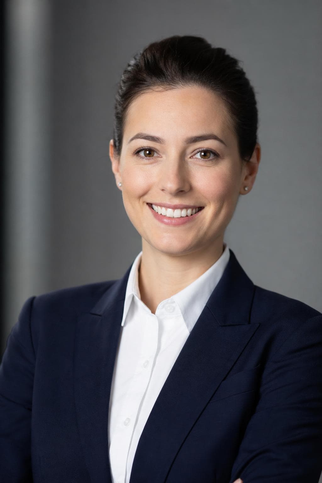 AI headshot in corporate style — woman in navy suit, grey office background